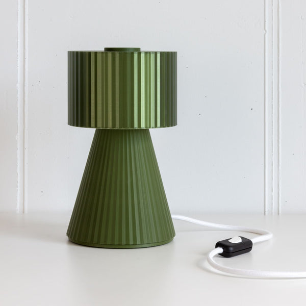 Lustra Plissé table lamp in Forest Green on white background with cable